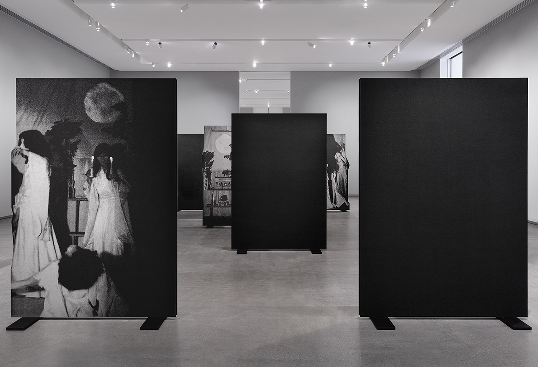 An installation within the gallery space at TarraWarra. Artworks stand mounted in black frames in rows.